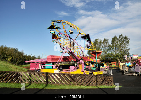 The Paratrooper ride glistening in early morning sunshine at the amusement park, Primrose Valley Holiday Park, Filey Stock Photo