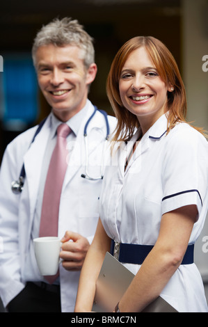 Doctor and nurse in waiting area Stock Photo