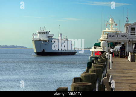 Car and passenger ferry approaches Port Jefferson harbor from Bridgeport CT Long Island NY Stock Photo