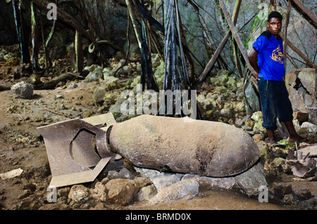 An unexploded bomb inside the 'Japanese Cave', Biak, West Papua, Indonesia. Stock Photo