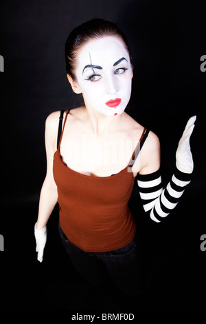 woman mime with theatrical makeup on black background Stock Photo