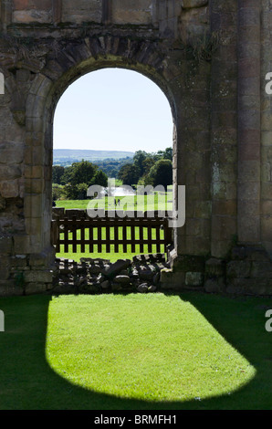 View through window in the ruins of Bolton Priory, Bolton Abbey, Wharfedale, Yorkshire Dales, North Yorkshire, England, UK Stock Photo