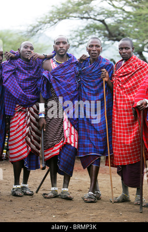 Maasai men wearing a traditional shuka robe walking in The