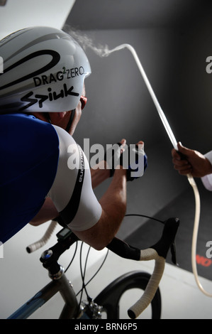 Aerodynamics expert Simon Smart uses a smoke test in a wind tunnel experiment for cycling clothing and racing bicycle design Stock Photo