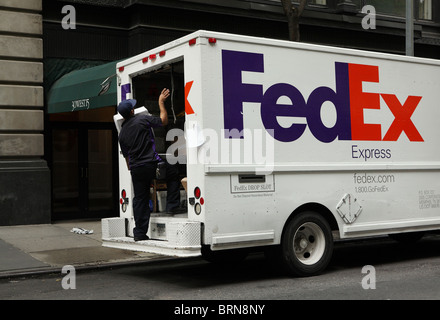 A FedEx truck and the driver, New York City, USA Stock Photo