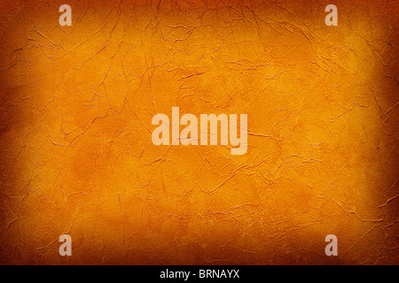 orange vignetted abstract texture for wallpaper or background Stock Photo