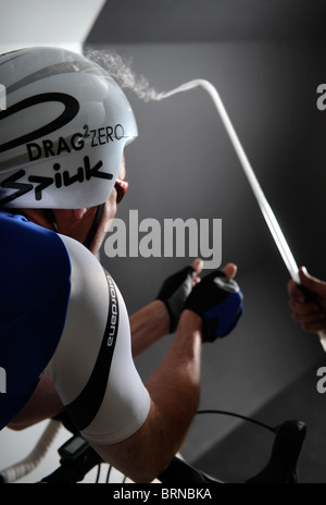 Aerodynamics expert Simon Smart uses a smoke test in a wind tunnel experiment for cycling clothing and racing bicycle design Stock Photo