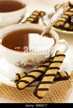 A cup of tea and chocolate cookies Stock Photo