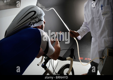 Aerodynamics expert Simon Smart uses a smoke test in a wind tunnel experiment for cycling clothing and racing bicycle design Stock Photo