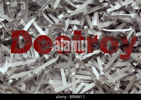 close up detail image of shredded paper with the words destroy printed on it Stock Photo