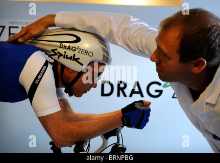 Aerodynamics expert Simon Smart uses a smoke test in a wind tunnel experiment for cycling clothing and racing bicycle design Stock Photo