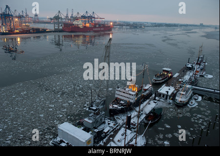 Europe Germany Hamburg, river Elbe , HHLA  container terminal Burchardkai and museum port Oevelgoenne in Winter Stock Photo