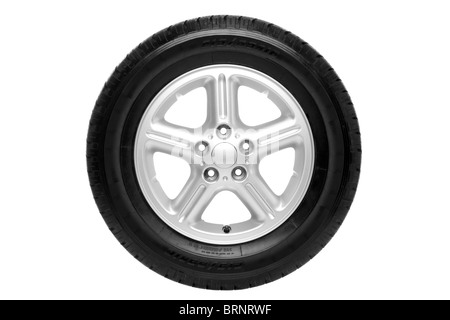 Photo of a car tyre (tire) on a five spoke alloy wheel isolated on a white background with clipping path. Stock Photo