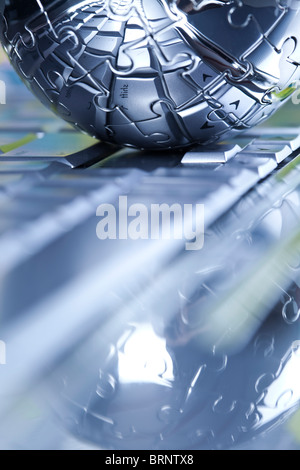 Globe made from puzzle Stock Photo