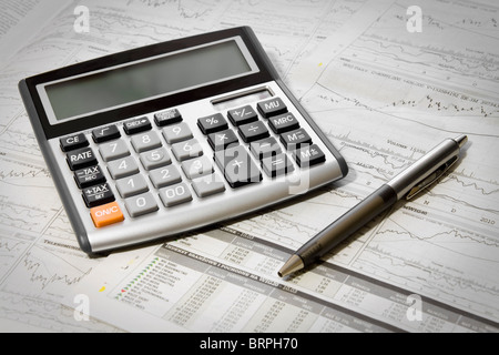 Pen, Calculator On A Financial Newpaper. Shot in studio. Stock Photo