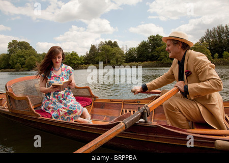 Father and daughter on a vintage boat Stock Photo