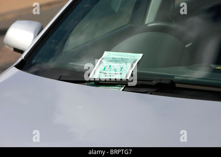 Penalty Charge Notice better known as a Parking Ticket on a windscreen of a car having been issued by a Traffic Warden Stock Photo