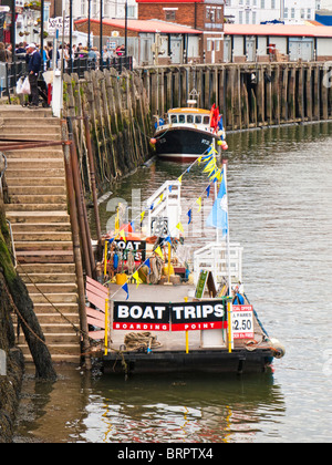 Boat trips boarding point on the Esk at Whitby North Yorkshire England UK Stock Photo