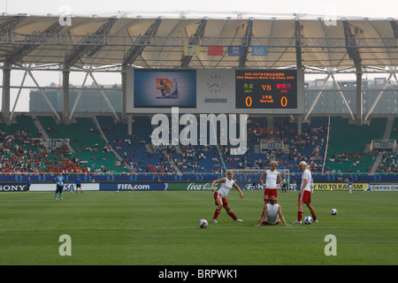 The Danish National Team warms up in Wuhan Sports Center Stadium prior to a 2007 Women's World Cup match against New Zealand. Stock Photo