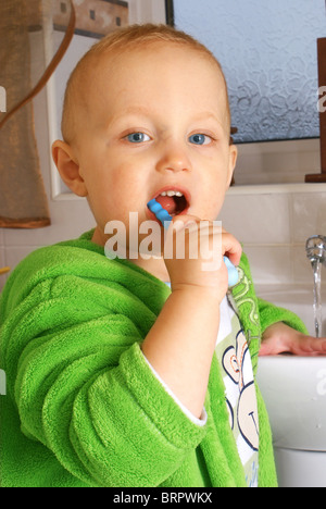 Dental care - small boy washing his teeth in the morning time Stock Photo