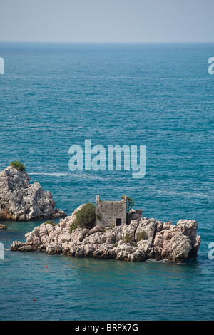 Smal Island with rustic house near Przno, Montenegro Stock Photo