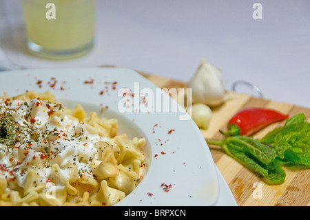 Turkish food manti filled with spiced meat mixture Stock Photo