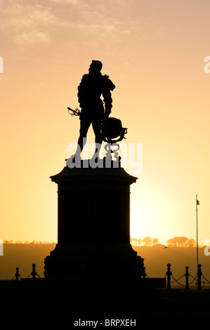 Statue of Sir Francis Drake on Plymouth Hoe, Plymouth, Devon UK with setting sun behind Stock Photo