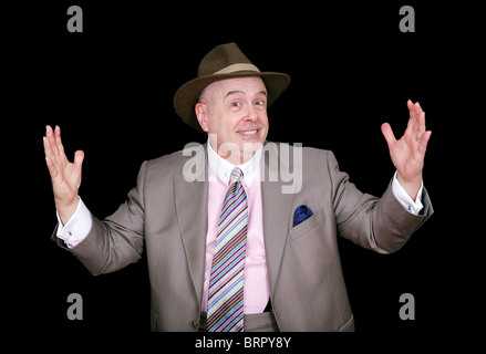 an older gent sporting his business coat and fedora looking happy Stock Photo