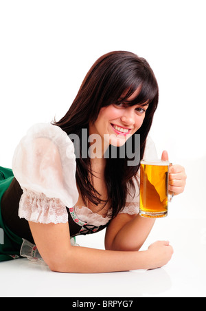 Pretty Girl Dressed In Traditional Costume For St Patrick's Day And Oktoberfest Holding A Beer Stock Photo