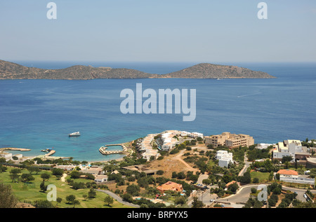 View towards the island of Spinalonga from the hills high above Elounda, Crete, Greece Stock Photo