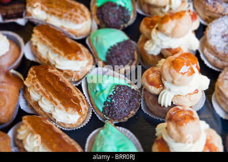 Cakes on sale in French bakery with shallow focus France Stock Photo
