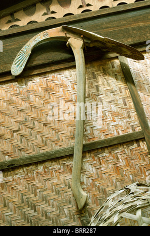 Traditional Thai Teak wooden House Ornate plough hanging on wall in Thailand home Gardening or crops cultivation and farming. Stock Photo