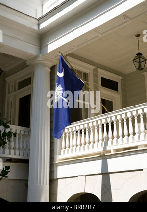 An official  South Carolina State Flag is prominently displayed on a porch in Charleston, SC, USA Stock Photo