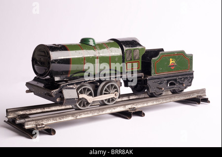 Tinplate Hornby 0 Gauge Train, circa 1950s on railway track with white background Stock Photo