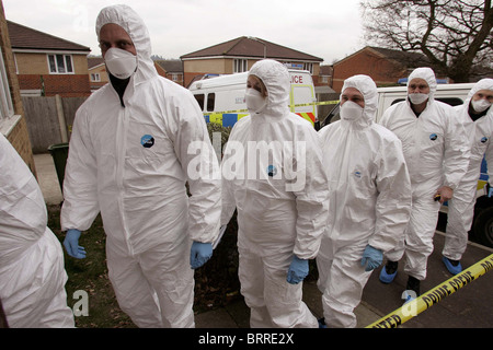 A team of Police forensic officers enter a  Crime scene. Picture by James Boardman