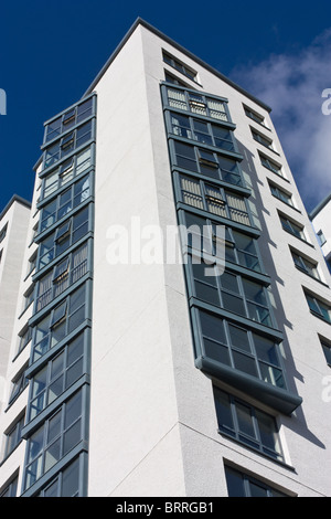 Abstract Architecture of hi rise tower block against vivid blue sky with converging verticals to emphasise or emphasize height. Stock Photo