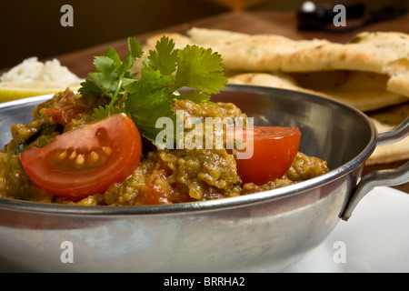Indian Curry meal of spicy chicken, rice and naan bread. Stock Photo