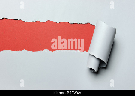 Gray Torn paper with red background in opening Stock Photo