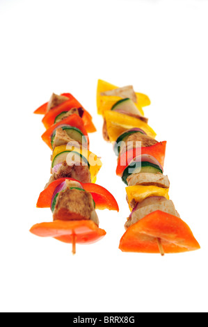 Two fresh chicken shishkebobs taken with a white background - focus on centre of image Stock Photo