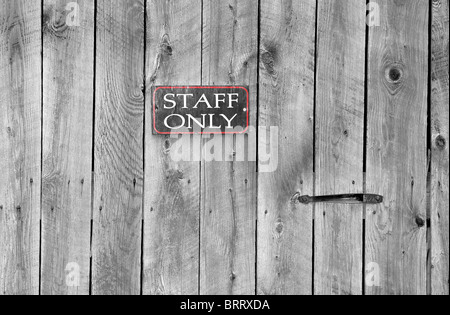 staff only sign on an old wooden door Stock Photo