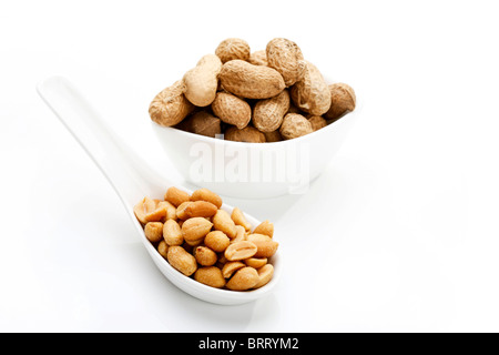 Salted peanuts and peanuts in shell Stock Photo