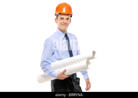 Young architect wearing protective helmet and holding blueprints Stock Photo