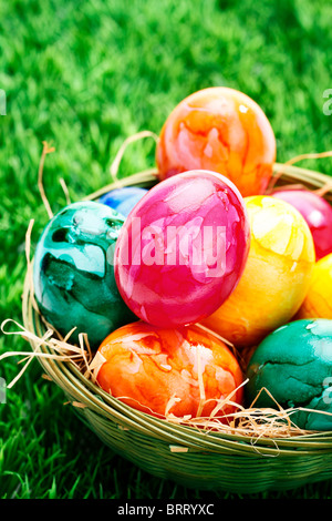 Easter eggs in an Easter nest on a lawn Stock Photo