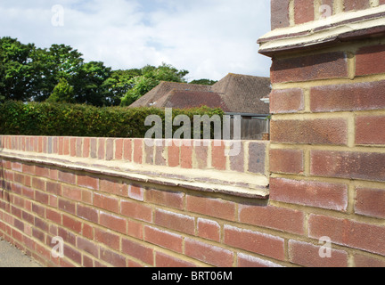 Newly constructed brick wall at the front of a house. Focus on foreground. Stock Photo