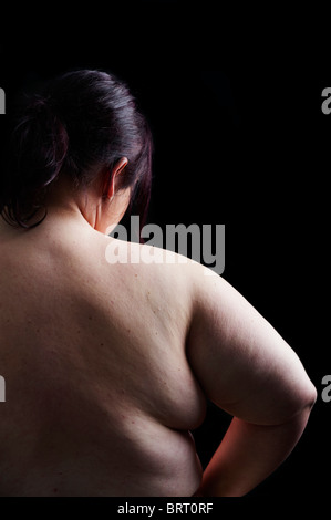 Young, fat woman, seen from behind Stock Photo