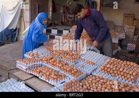 Moslem woman purchasing eggs;Fez Medina;Morocco Stock Photo