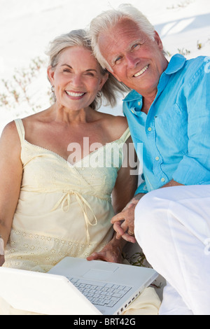 Happy senior couple using laptop Stock Photo - Alamy