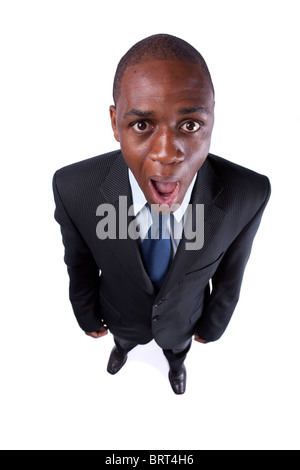 African businessman screaming with a strange face expression and open mouth (isolated on white) Stock Photo