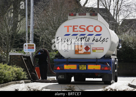 A Tesco Fuel Tanker restock supplies at a Petrol station. Picture by James Boardman Stock Photo