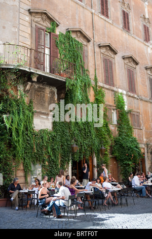 People sitting in 'Bar della Pace' typical traditional bar caffè of Rome city situated in old town Italy Europe Stock Photo
